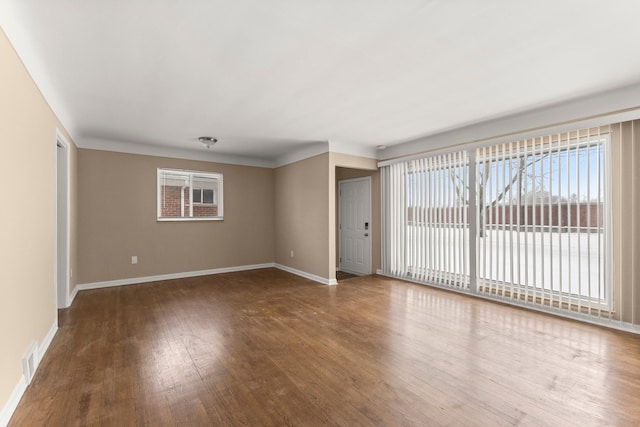 spare room featuring hardwood / wood-style flooring