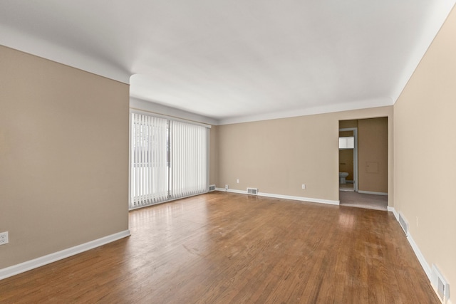 empty room with wood-type flooring