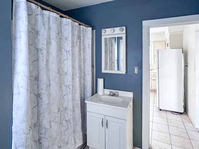 bathroom with tile patterned flooring and vanity