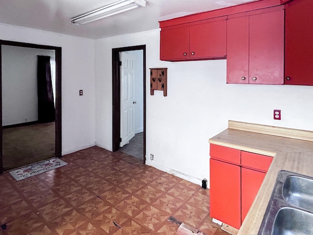 kitchen featuring parquet flooring