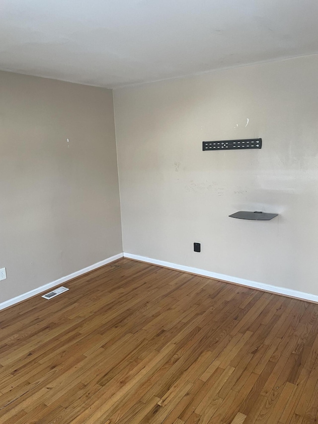 empty room with wood-type flooring