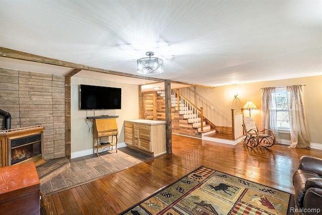 living room with dark hardwood / wood-style flooring