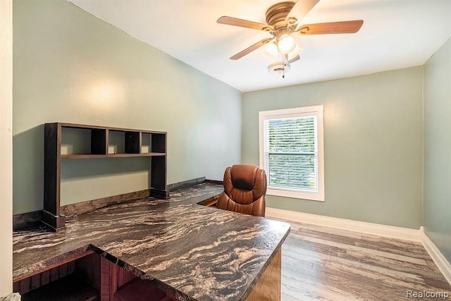 office space with ceiling fan and wood-type flooring