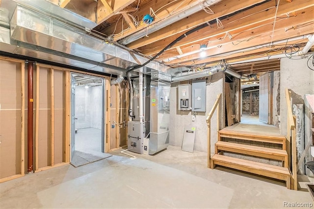 basement with electric panel and heating unit