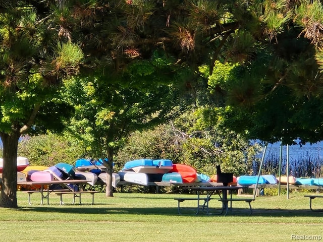 view of playground with a lawn