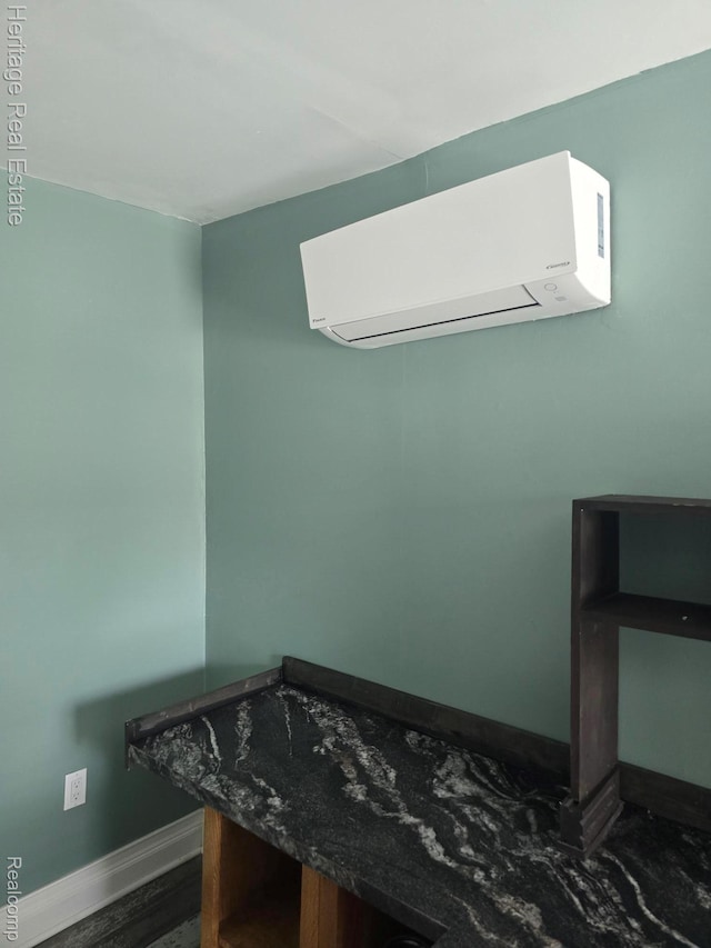 4694 Herd Rd, Metamora, MI 48455 - detailed view of a wall unit AC and wood finished floors