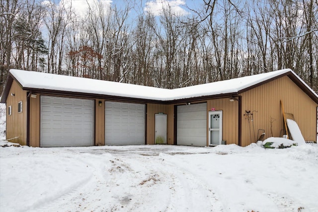 view of snow covered garage