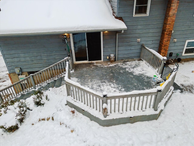 view of snow covered deck