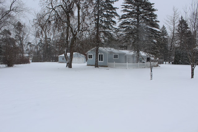 view of yard covered in snow