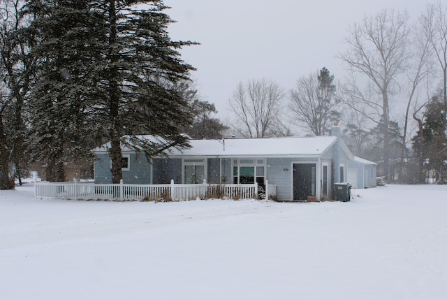 view of front of house featuring a garage and a porch