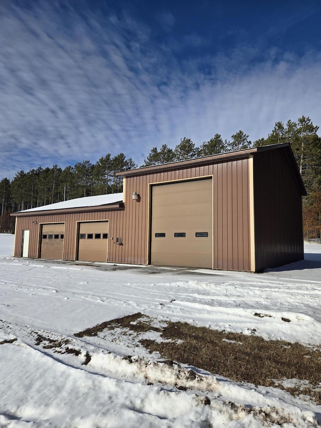 view of snow covered garage