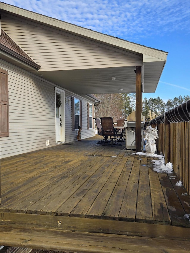 deck featuring a grill