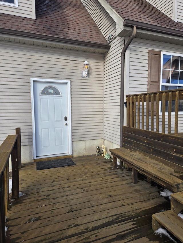 entrance to property with a deck