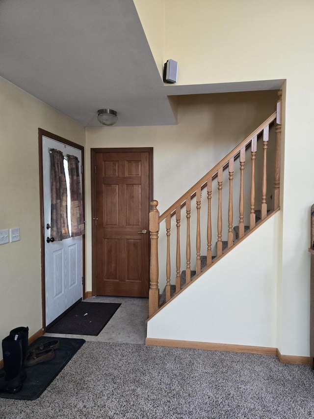 view of carpeted entrance foyer