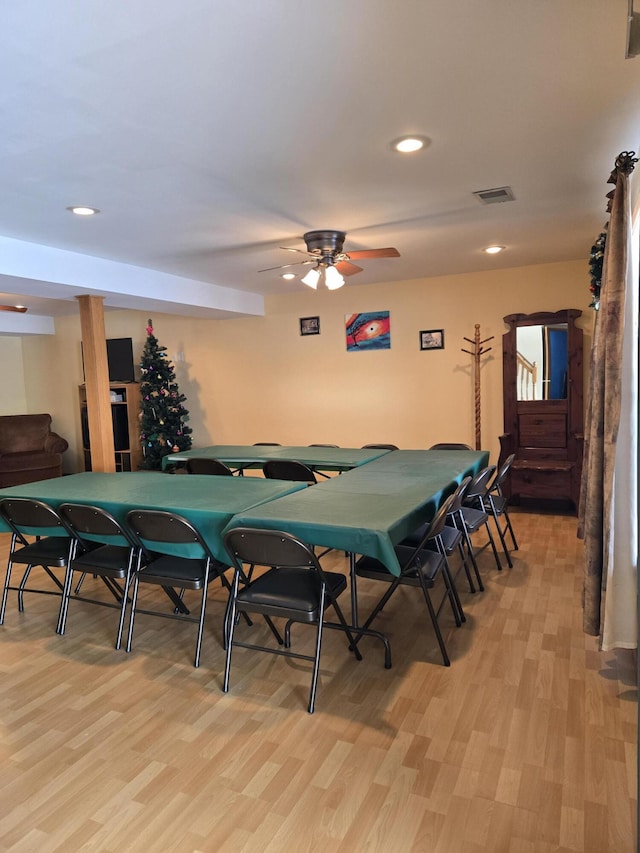 rec room with ceiling fan and light hardwood / wood-style floors