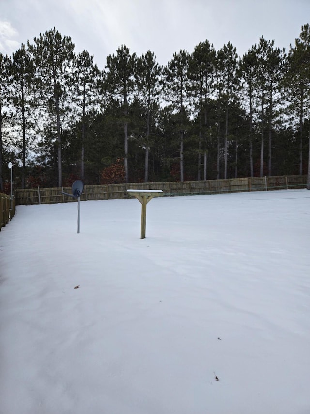 view of yard layered in snow