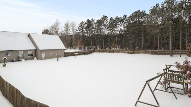 view of yard layered in snow