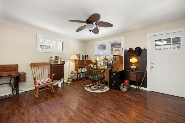 home office with ceiling fan and dark hardwood / wood-style flooring