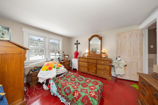 bedroom with dark hardwood / wood-style floors