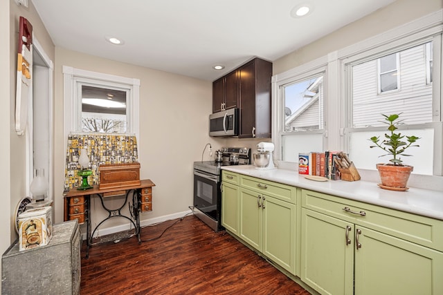 kitchen with dark wood-type flooring and appliances with stainless steel finishes