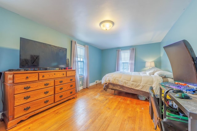 bedroom with light hardwood / wood-style floors