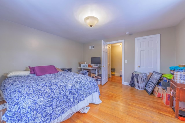 bedroom featuring wood-type flooring