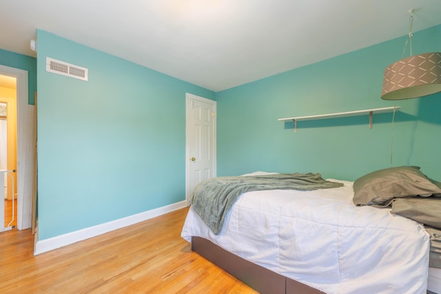 bedroom featuring wood-type flooring