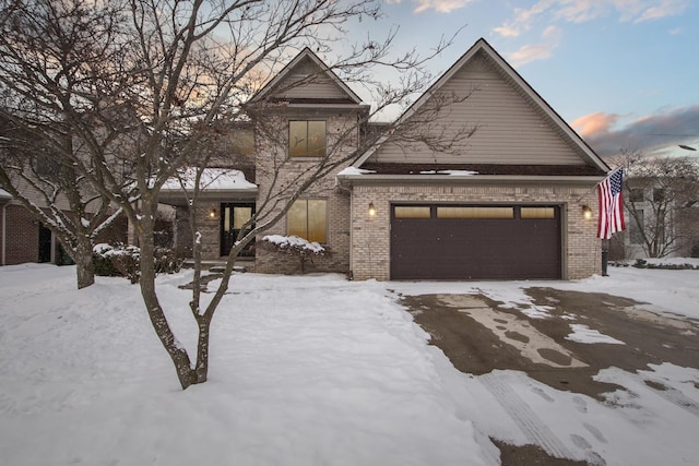 traditional-style home with brick siding and an attached garage