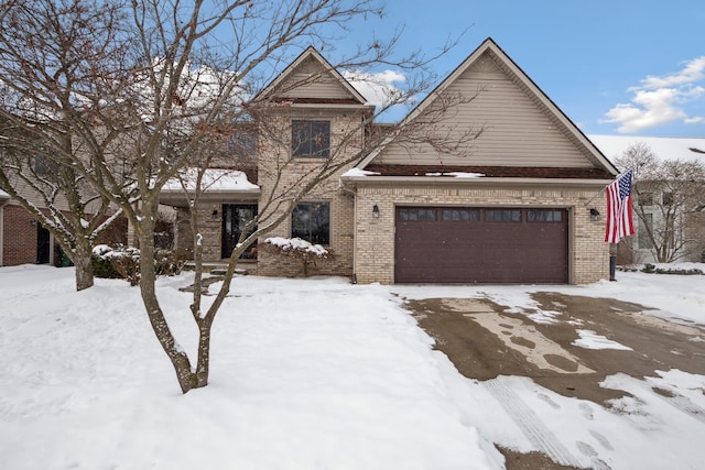 traditional-style house featuring brick siding and an attached garage