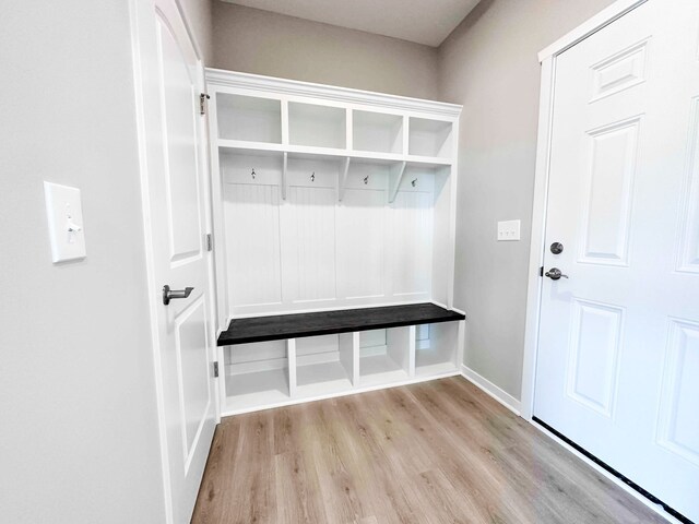 mudroom with light hardwood / wood-style floors