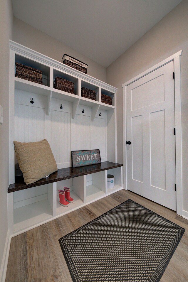 mudroom with light hardwood / wood-style flooring