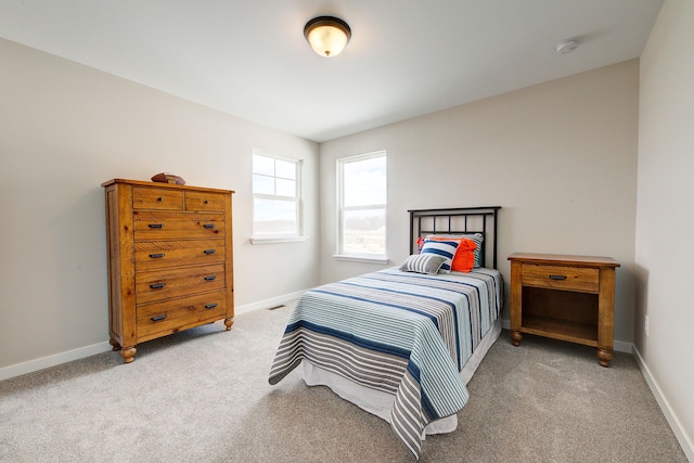 bedroom with light colored carpet