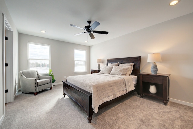 bedroom with light carpet and ceiling fan