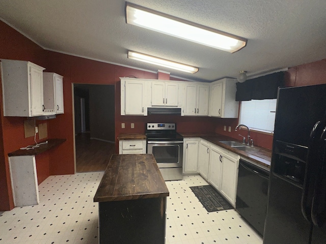 kitchen featuring lofted ceiling, range hood, a kitchen island, black appliances, and sink