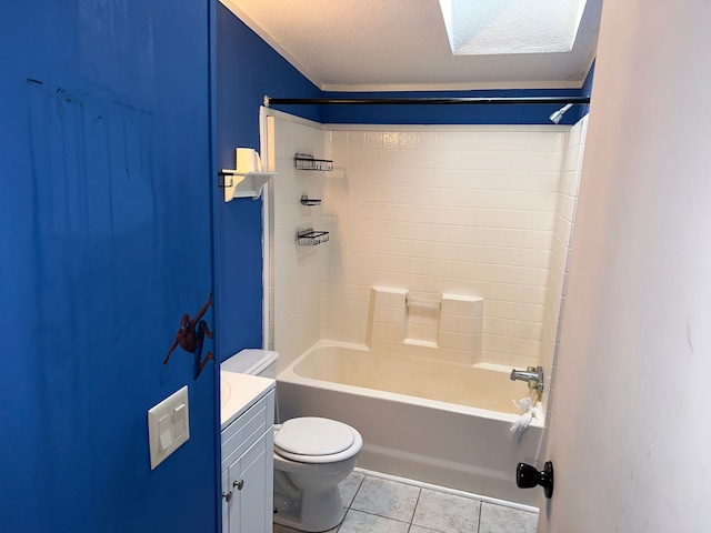 full bathroom with toilet, vanity, tile patterned floors,  shower combination, and a textured ceiling