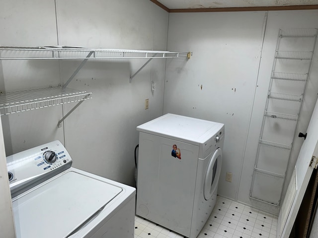 washroom featuring independent washer and dryer