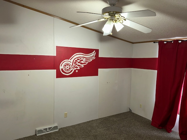 carpeted empty room with a textured ceiling, ceiling fan, lofted ceiling, and crown molding