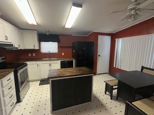 kitchen with ceiling fan, vaulted ceiling, black appliances, white cabinets, and sink