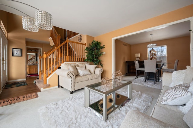 living room with a notable chandelier