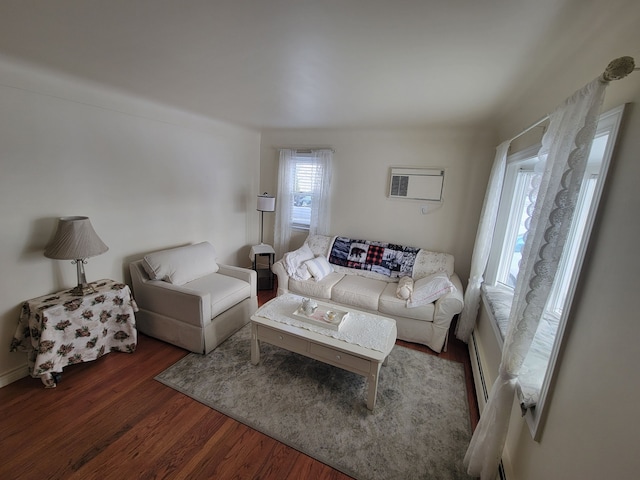 living room with dark hardwood / wood-style floors and a wall mounted air conditioner