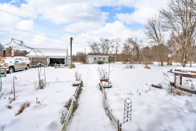 view of yard layered in snow