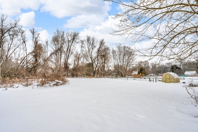 view of yard layered in snow