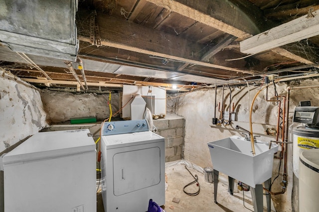 laundry room featuring sink and washer / dryer