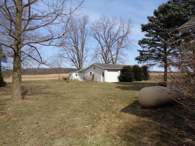 view of home's exterior with a lawn and an attached garage