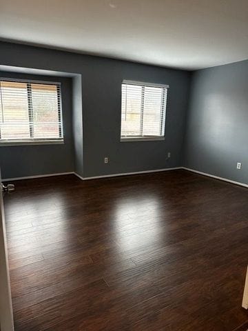 empty room featuring dark hardwood / wood-style floors