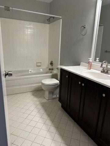 full bathroom with shower / bathing tub combination, vanity, tile patterned flooring, and toilet