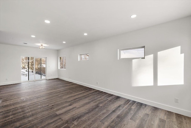 empty room featuring dark hardwood / wood-style flooring