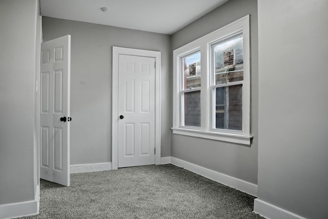 unfurnished bedroom with carpet