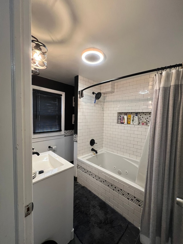 bathroom with shower / bathtub combination with curtain and vanity