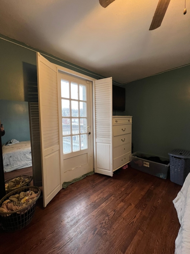 bedroom with dark wood-type flooring and ceiling fan